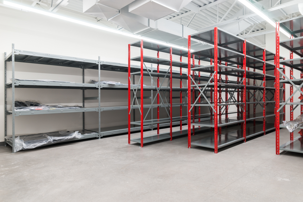 Grey and red industrial shelving in a car dealership