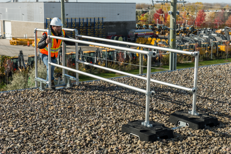 A ladder stabilizer on a flat roof.