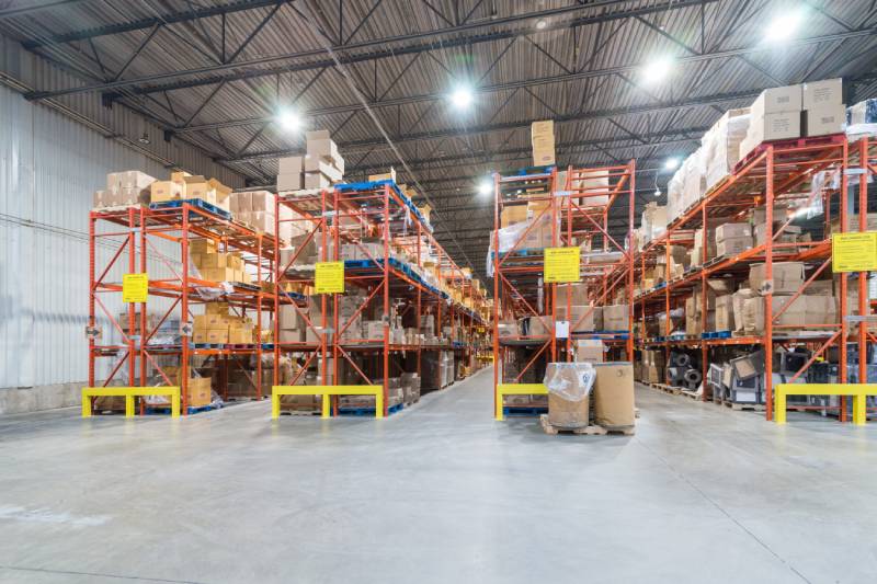 Orange and yellow very narrow aisle pallet racks.